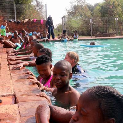 Help Camp Sizanani Life Skills by Swimming Kicks Boards and Noodles  for At-risk Children and Teenagers 